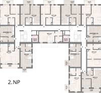Floor plan of the second level with the layout of apartments and suites, including balconies and storage rooms.