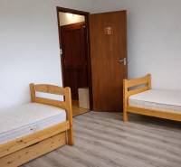 Children's room with standard beds and a floor with wood decor in a 3-room apartment.