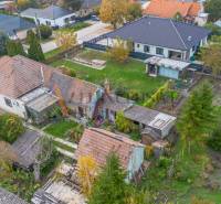 Family houses with a yard and garden in Veľké Dvorníky in the autumn season.
