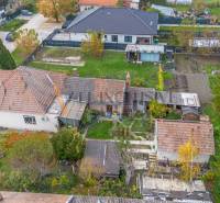 A family house in Veľké Dvorníky with a spacious garden and surrounding greenery.
