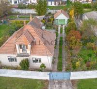 Family house in Veľké Dvorníky with a front garden and access road.