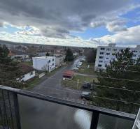 View from a 4-room apartment on Gyurkyho in Šahy, showing a city street and houses.