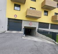 Residential building on Hviezdoslavova Street in Poprad with a garage entrance and balconies.