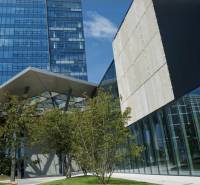 Glass facade of the building with a canopy and greenery at Mlynské Nivy, Bratislava - Nivy, offices.