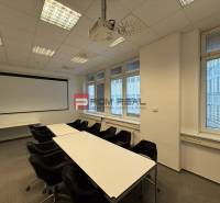 Conference room with a projector and projection screen in the offices.