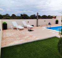 Terrace with loungers and a pool in a family house on Mulo Street in Vrsi.