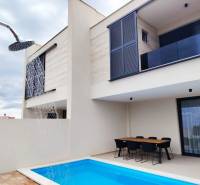 A family house on Mulo Street in Vrsi with a terrace, swimming pool, and outdoor shower.