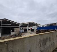 Warehouses and halls on Strojnícka Street in Prešov with steel structures and wood.