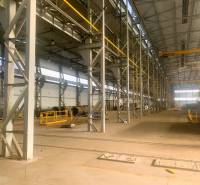 Production facilities with a wide hall, steel structures, and equipment.