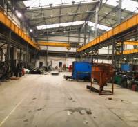 Production premises in Spišská Nová Ves with high ceilings and industrial equipment.