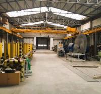 Production premises in Spišská Nová Ves with warehouses and a crane, industrial design.