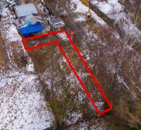 Aerial view of a snow-covered garden in Nálepkovo with a marked plot.