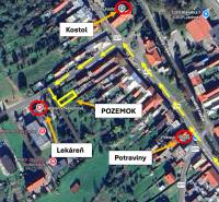 An aerial map of part of the village Nálepkovo shows a church, a pharmacy, and grocery stores around the gardens.
