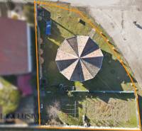 Aerial view of a plot in Zemianska Olča designated for housing, with an octagonal building.