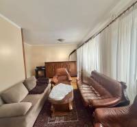 Living room with sofas and a coffee table in a family house.
