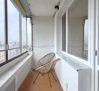 The glazed balcony of the two-room apartment offers a view of Petržalka, Holíčska Street, and the surrounding area.