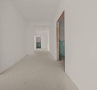A hallway under construction in a 4-room apartment with unfinished doorways and neutral walls.