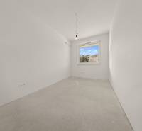 Empty room with a window, simple walls, part of a 4-room apartment.