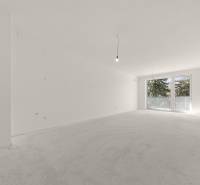 A spacious room in a 4-room apartment with a large French window and white walls.