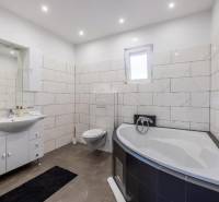 Bathroom in a villa with a bathtub, wall-hung toilet, and modern tiles.