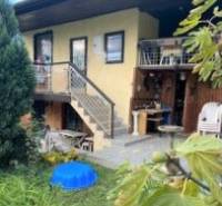 A two-story cottage in Košice, Vyšné Opátske district, in a natural setting.