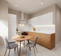 A kitchen in a 2-room apartment with a wood-patterned floor and modern appliances.