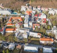 Aerial view of Trenčianske Teplice, Hurbanova Street with commercial plots and surroundings.