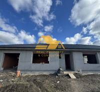 A family house under construction on a street in Nové Zámky. Without finished windows and doors.