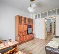 Living room in a family house with wooden furniture and comfortable seating.