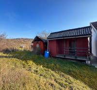 On Ambrovej Street in Nitra, modest wooden cottages are visible among the vineyards.