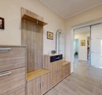 Interior of a family house with a wooden decor floor, furniture, and decorations.