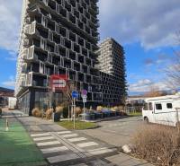 Buildings with prominent balconies and a white caravan on Račianska in Bratislava III.