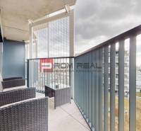 A balcony with rattan furniture in a 2-room apartment on Račianska Street in Bratislava III.