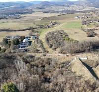 Aerial view of plots - housing in Krupina surrounded by hills and nature.