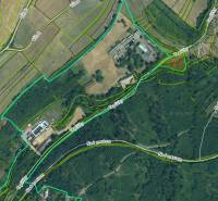 Aerial view of plots - housing around Krupina with visible roads and parcels.