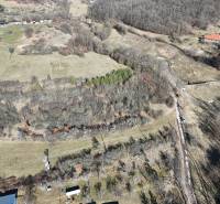 Aerial view of residential plots in Krupina, surrounded by nature and trees.