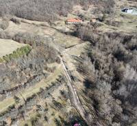 Plots - housing in Krupina near the forest with a rural landscape and grassy areas.