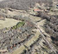 Aerial view of properties - housing in Krupina with trees and meadows around.