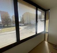 Glazed balcony in a 3-room apartment on Matice Slovenskej Street, Prešov, with a view of the parking lot.