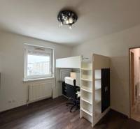 Children's room in a 3-room apartment with a bunk bed and a floor with a wooden decor.
