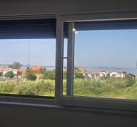 The view from the Villa on Zukve in Vrsi offers a sight of rooftops and the coastline.