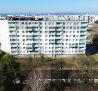 An apartment building on Leningradská Street in Michalovce surrounded by greenery near three-room apartments.