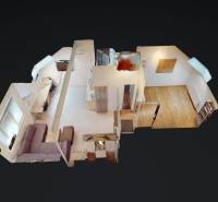 3D model of an office with a wood-patterned floor and minimalist furniture.