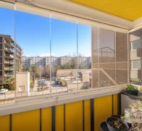 Enclosed loggia with a view of modern apartment buildings, 3-room apartment, Dúbravka, Bratislava.