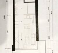 Floor plan of a 1-bedroom apartment with a kitchen, bathroom, terrace, and living area.