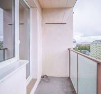 The balcony of a 2-room apartment in Poprad with a view of the housing estate and panel buildings.