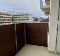 A balcony in a 2-room apartment with a view of the buildings on Pivovarská Street in Nitra.
