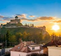 View of Trenčín Castle at sunset from Hodžova Street in Trenčín.
