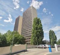 High-rise buildings surrounded by greenery on Kutlíkova Street in Bratislava - Lúky, offices.