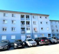 A building with a parking lot on Vodárenská Street in Galanta, suitable for a 1-room apartment.